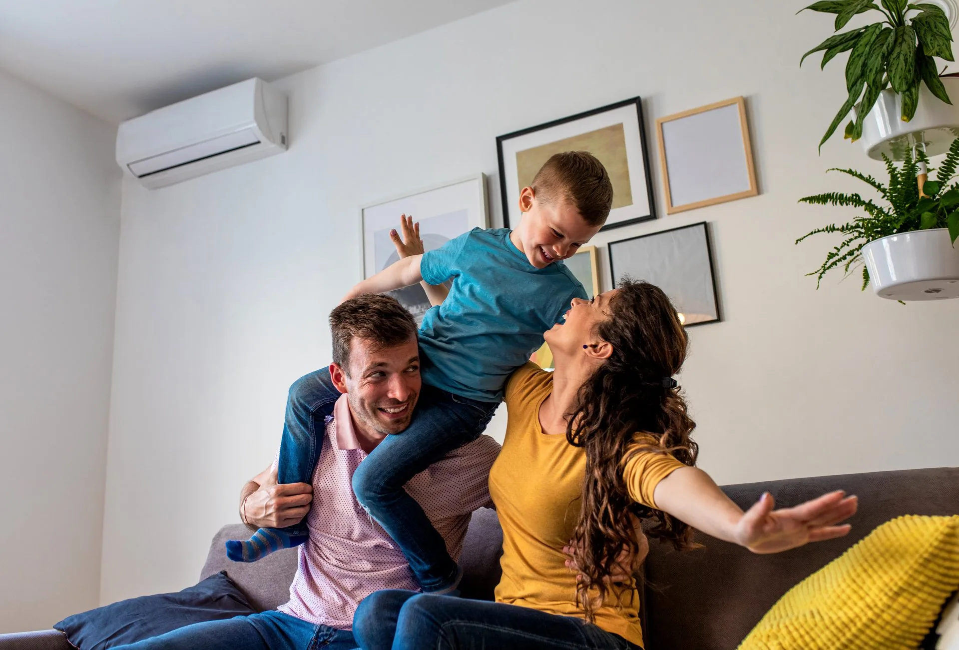 Happy family enjoying comfortable home temperature